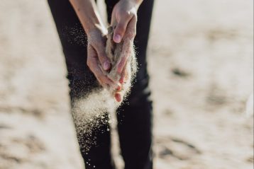 sand slipping through hands