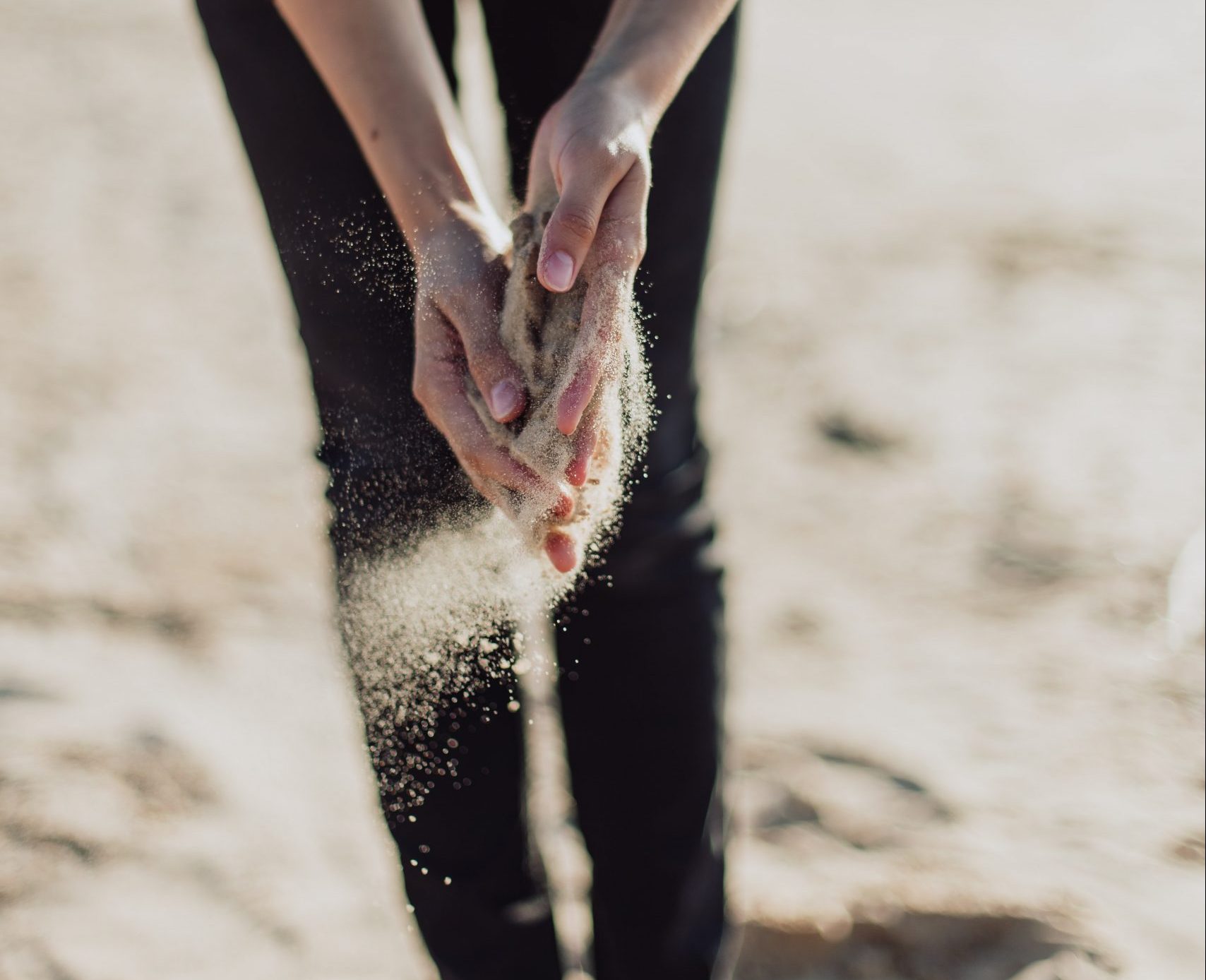 sand slipping through hands