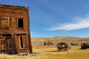 brown 2-storey house near wagon