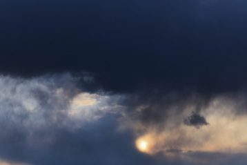 dark sky with white clouds