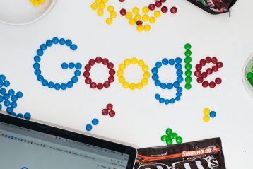 photo of M&M forming Google chocolate candies on table