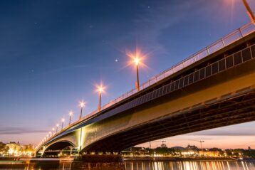 bridge under blue sky during night time