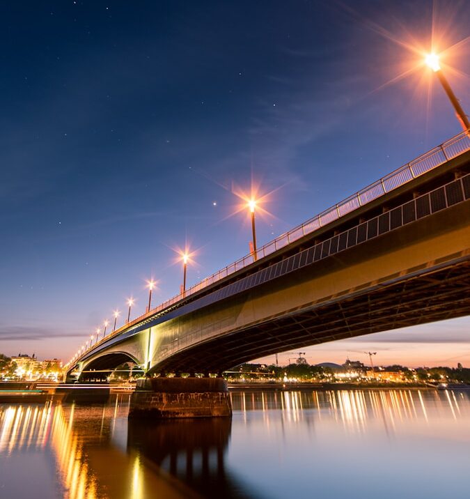 bridge under blue sky during night time