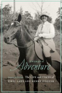 Book cover of A Woman of Adventure: The Life and Times of First Lady Lou Henry Hoover, featuring a black and white photograph of Lou Hoover on a horse
