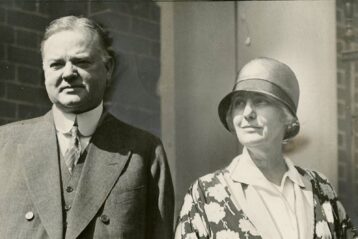 A black and white photo of Herbert and Lou Hoover