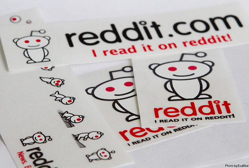 a pile of reddit logo stickers