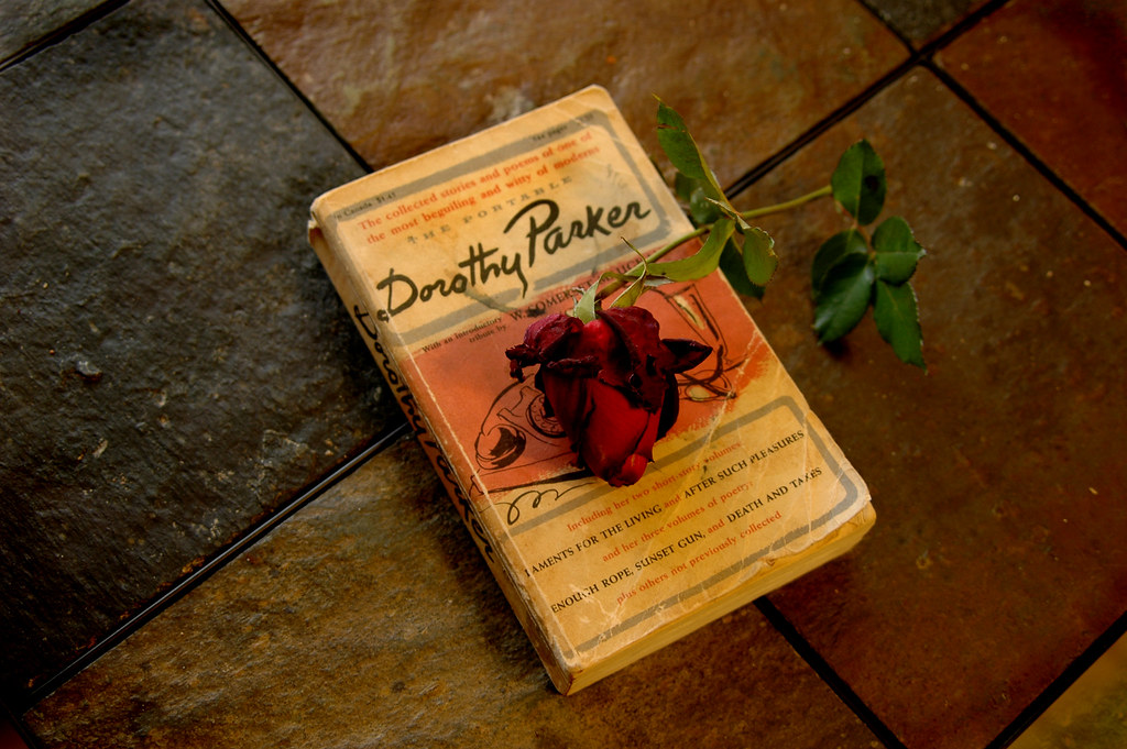 photo of a dorothy parker book with a rose on top