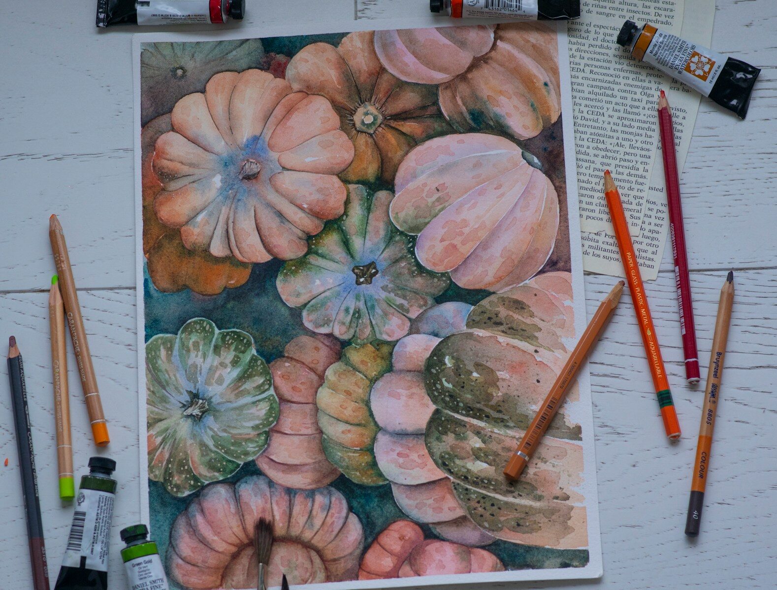 a painting of flowers and leaves on a table